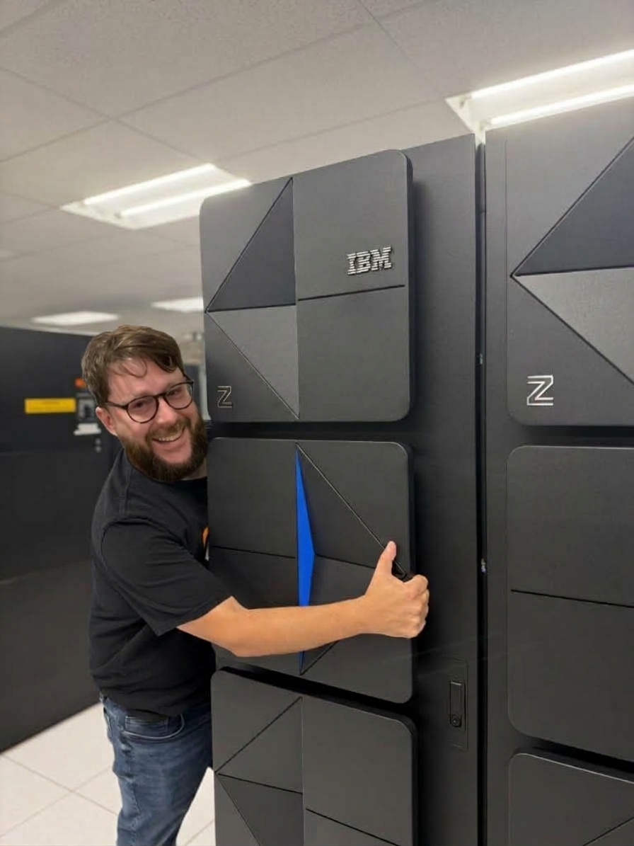 A person hugging an IBM mainframe